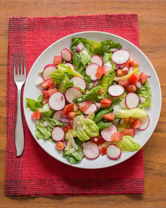 plate of radish salad on a red napkin