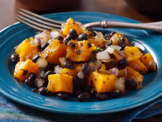 blue bowl with butternut squash and black beans