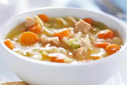 white bowl of chicken noodle soup