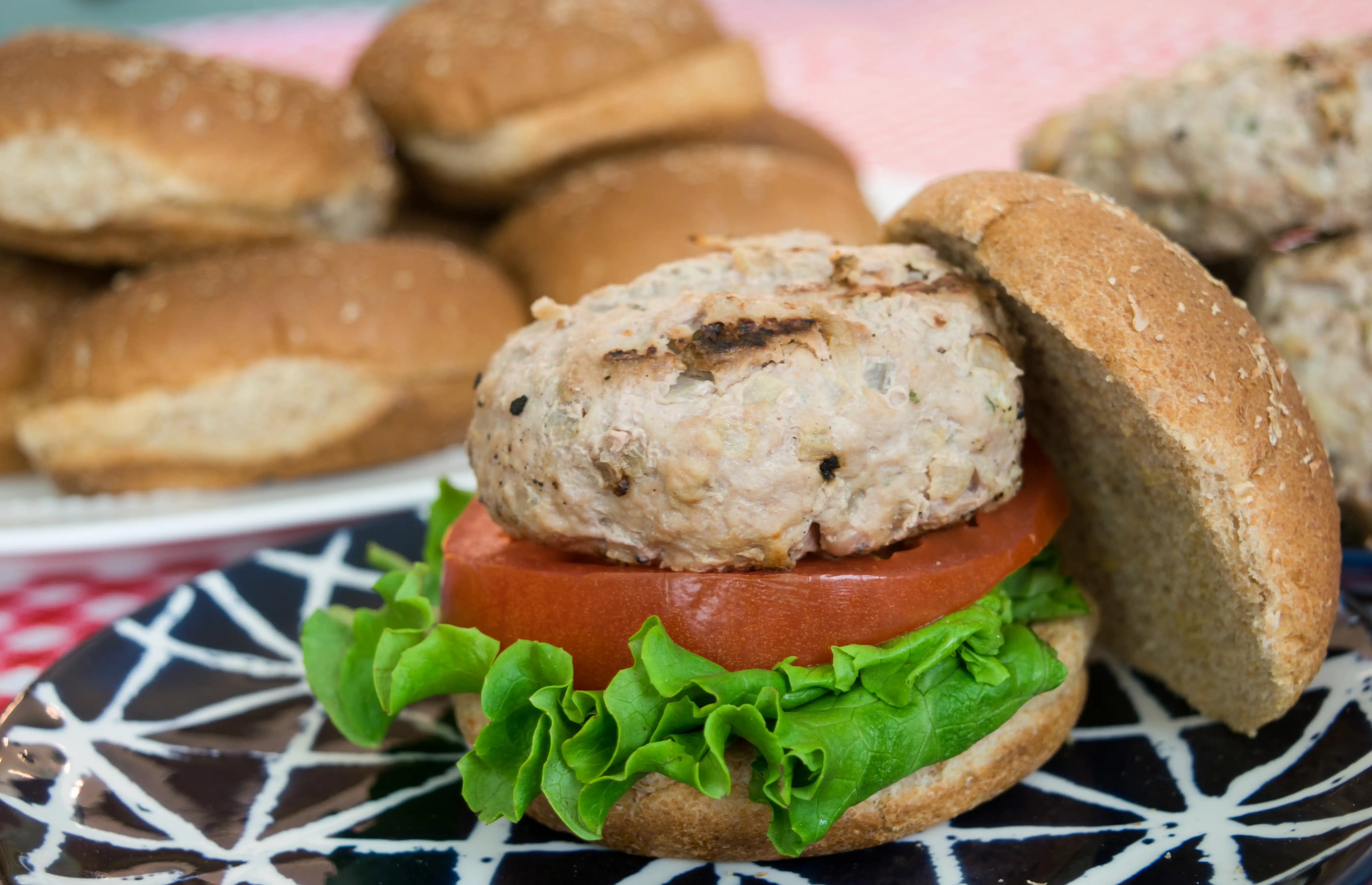 a turkey burger with lettuce and tomato