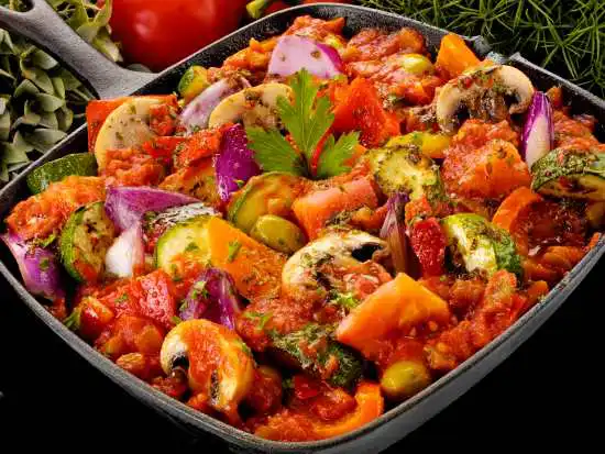 skillet with zucchini and other vegetables