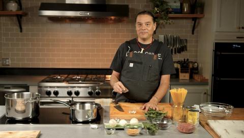 photo of Chef Sean Sherman cooking