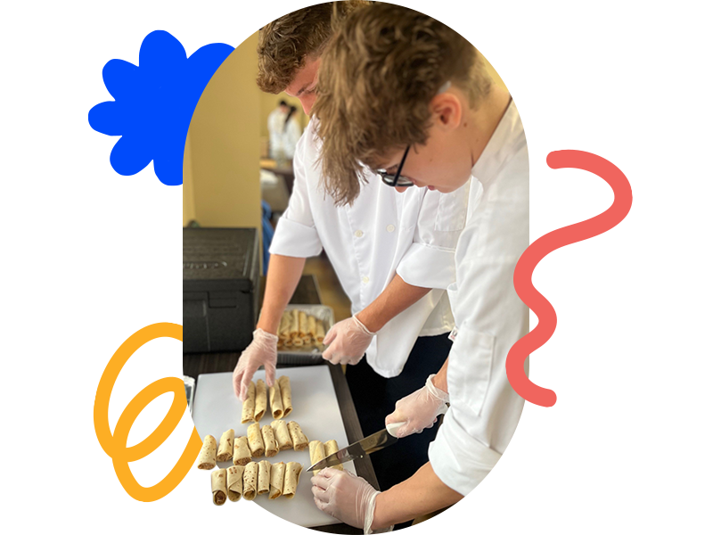 middle schoolers preparing sandwich wraps