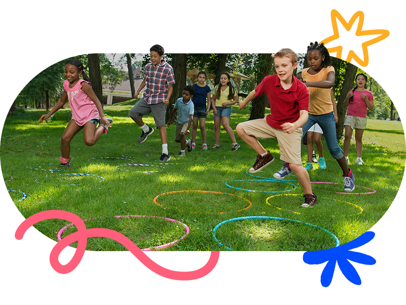 kids running through an obstacle course outside