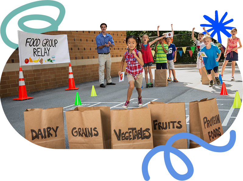 elementary school-aged children running in a food group relay game