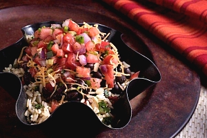 burrito bowl with diced tomato and onion topping
