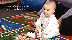 Infant Sitting Up with Child Care Provider