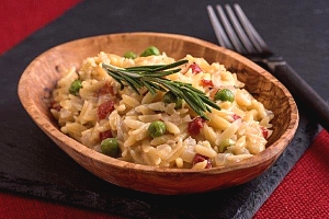 bowl of orzo pasta with green peas