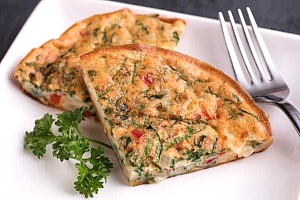 two triangular pieces of quiche on a plate