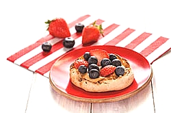 English muffin with peanut butter and berries