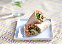 A rolled sandwich wrap made with hummus