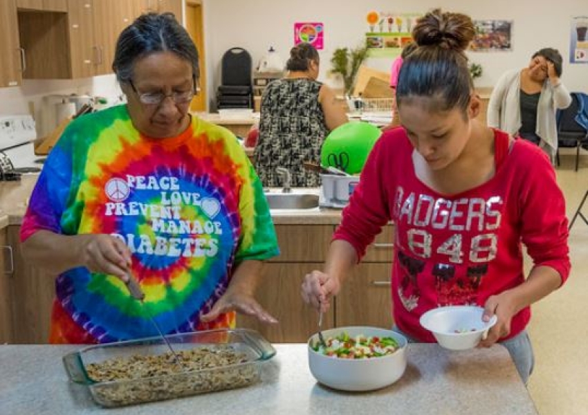 two women participating in a cooking class
