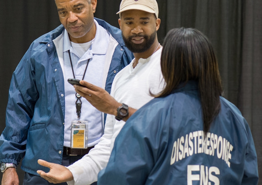 group of disaster responders talking