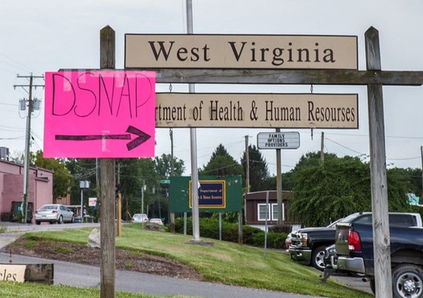 West Virginia Department of Health and Human Resources sign with a pink posterboard pointing the way towards D-SNAP