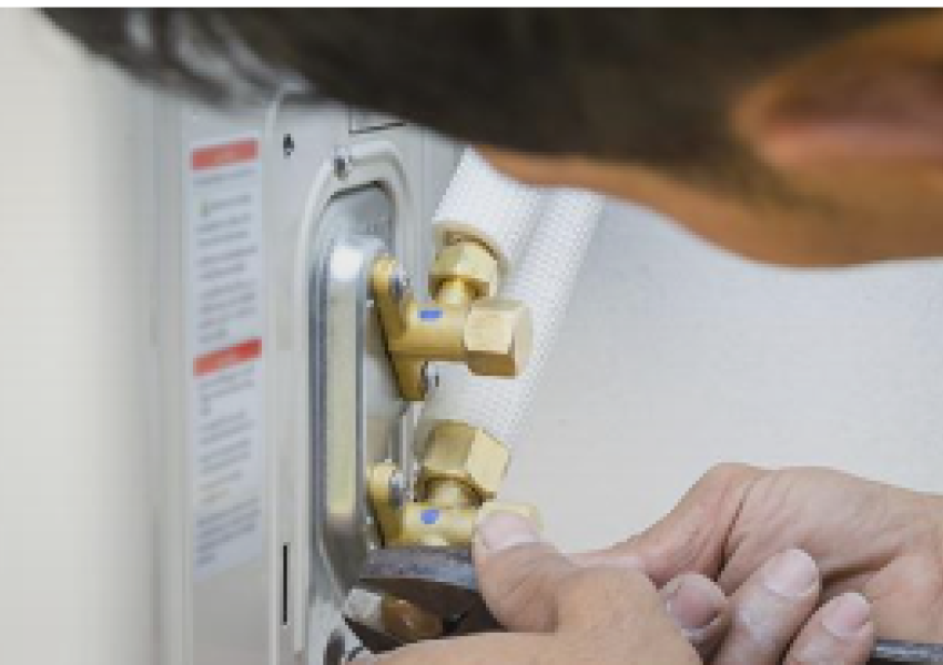 Man fixing water fixture.