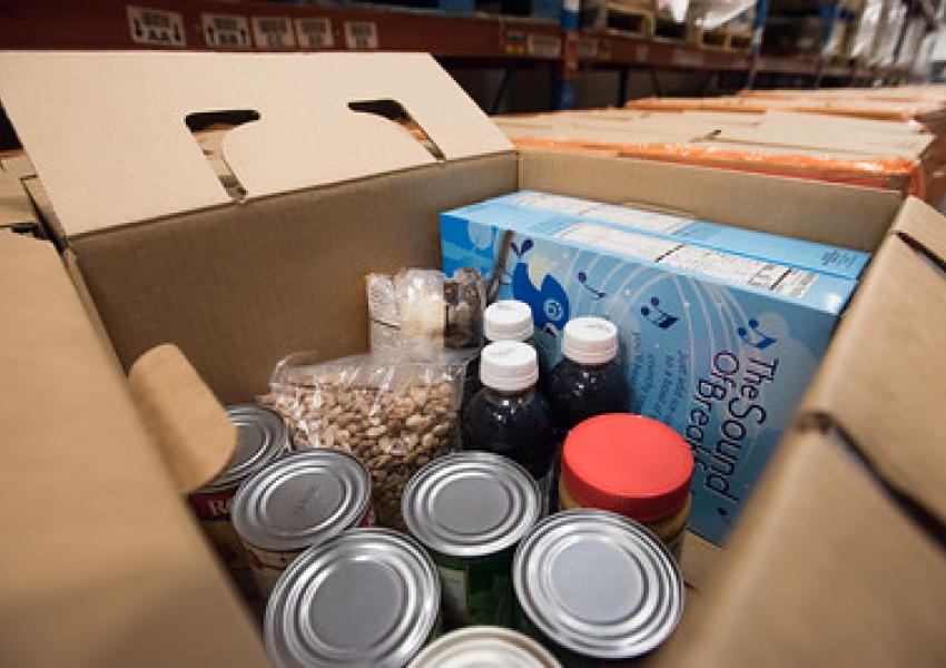 image of canned goods and cereal in a cardboard box