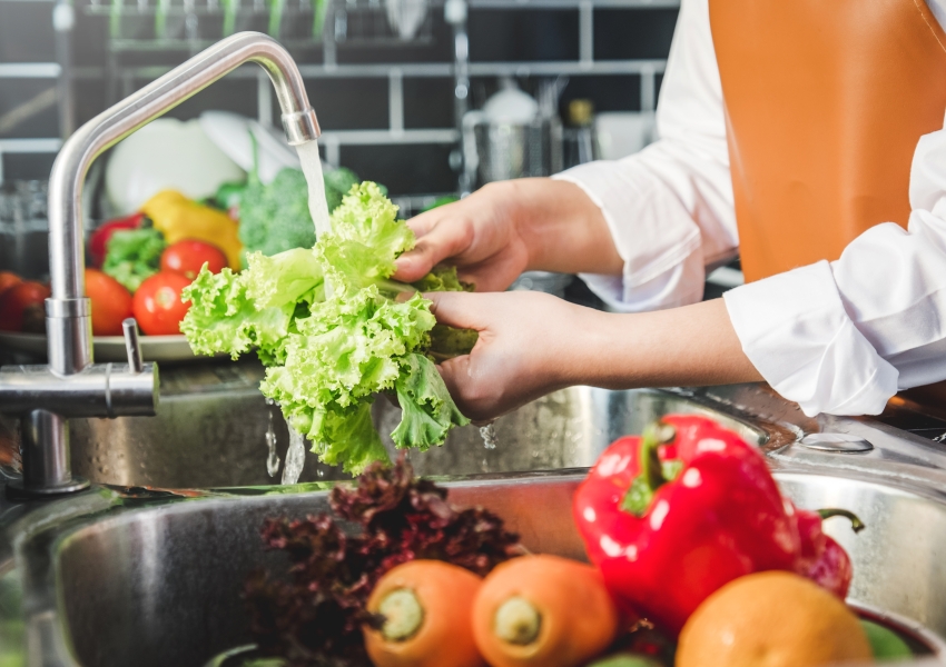 washing fresh produce in a sink