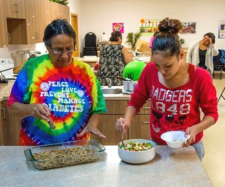 two women participating in a cooking class