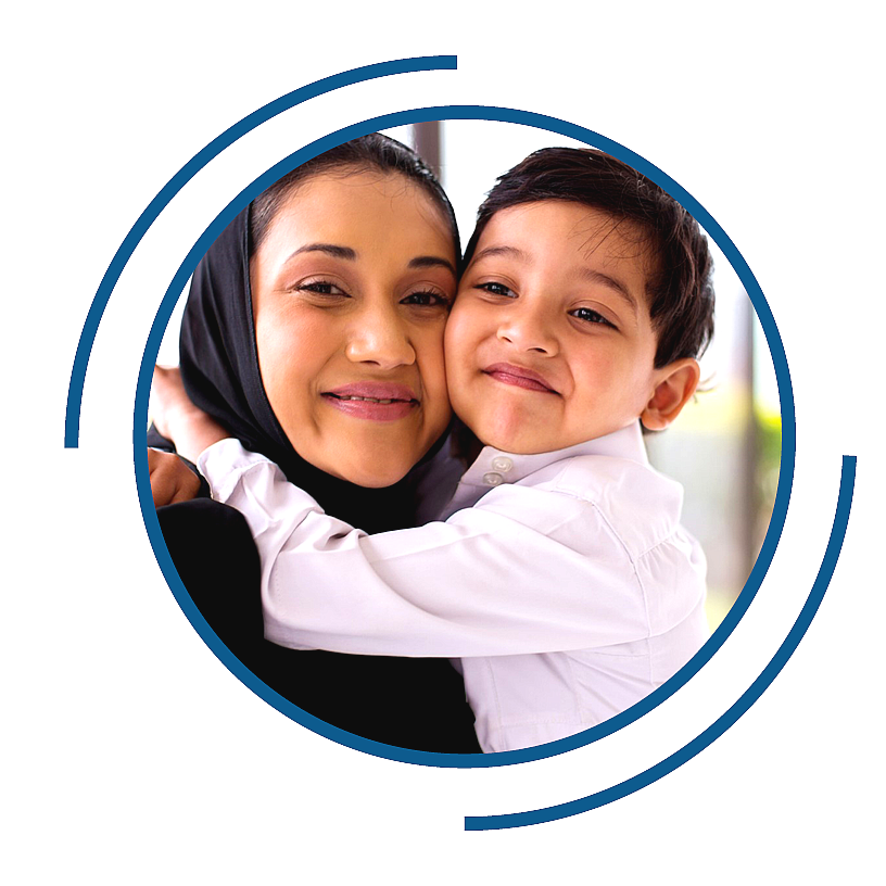 A woman holding her child in her arms.